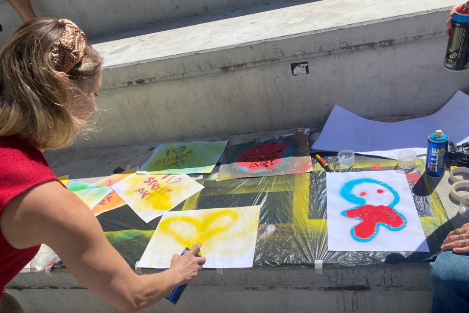 Student painting during a graffiti workshop in Lavapiés