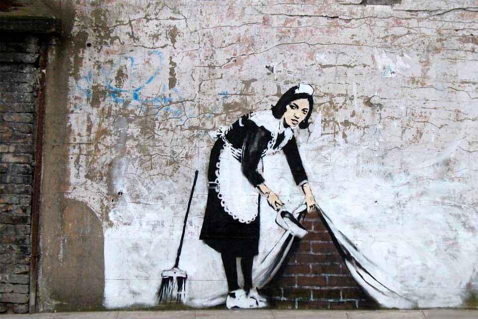 Banksy Sweeping It Under The Carpet