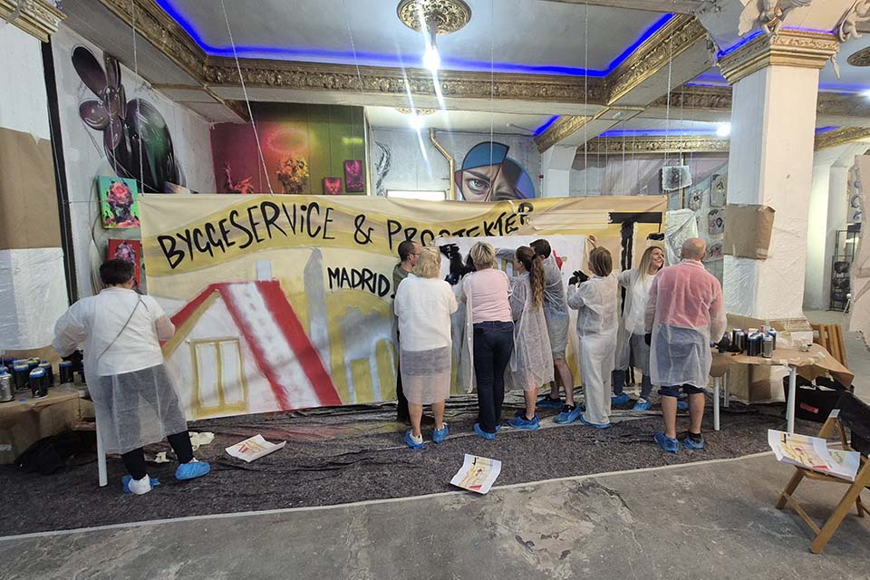 Guests painting over a cotton canvas