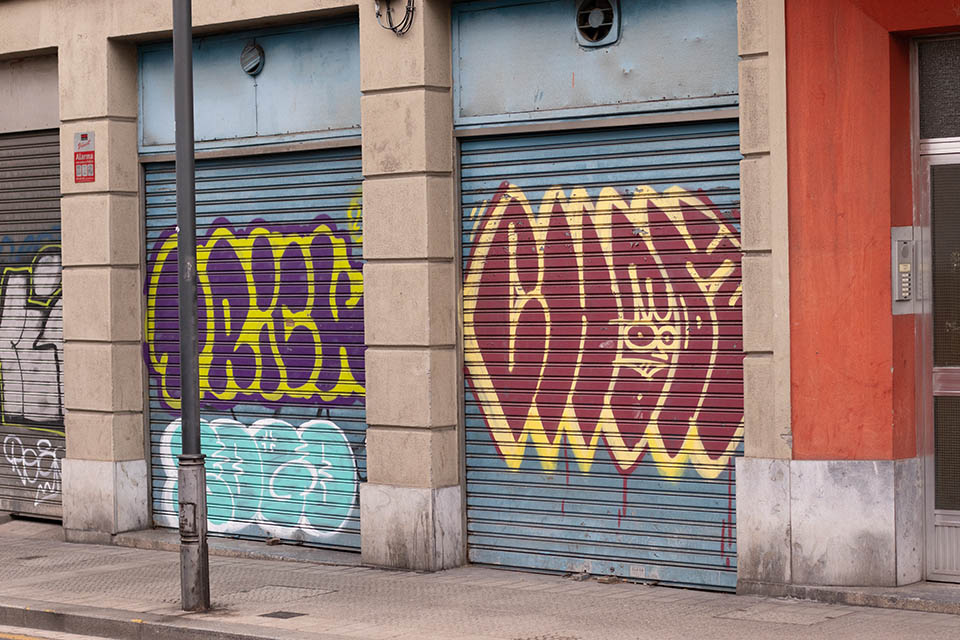 graffiti over metal shutters