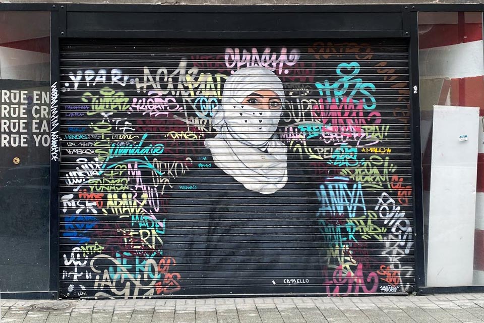 Metal shutter painted by a street art artist