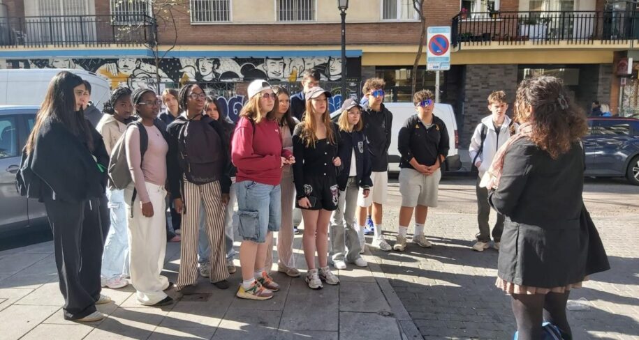 Educational group listening to Christine's explanations in Lavapies