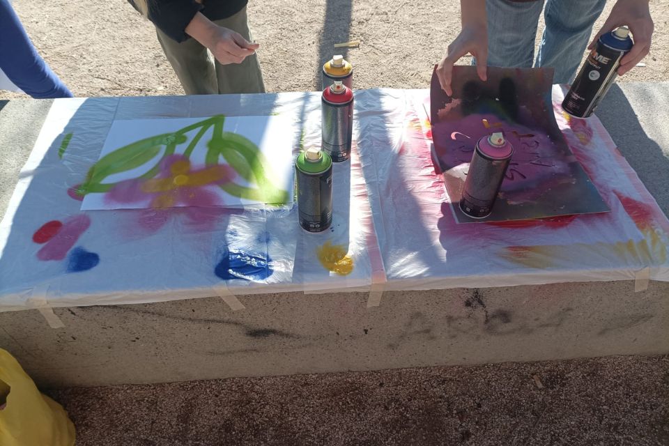 Graffiti workshop outside with a student travel agency