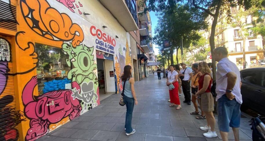 One of cooltourspain guide explaining a mural in lavapiés